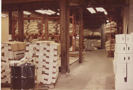 Pallets of beer cases and bags of malt barley