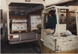 Sonny Chu loading delivery van for delivery to licensees